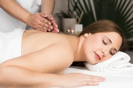 woman-receiving-massage-spa-center.webp