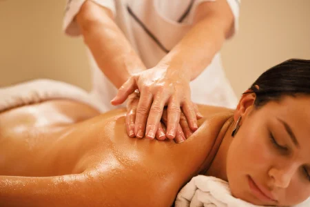 closeup-woman-relaxing-back-massage-spa-salon.webp